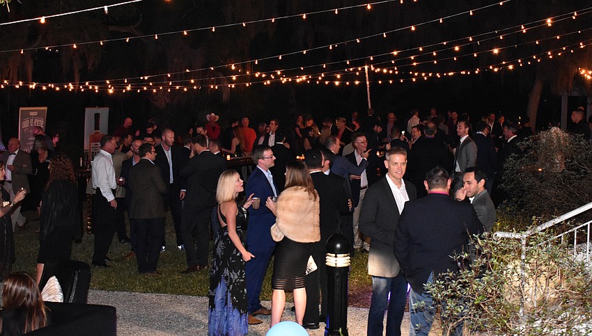 Guests enjoyed drinks on the back lawn of Edson Keith Mansion.