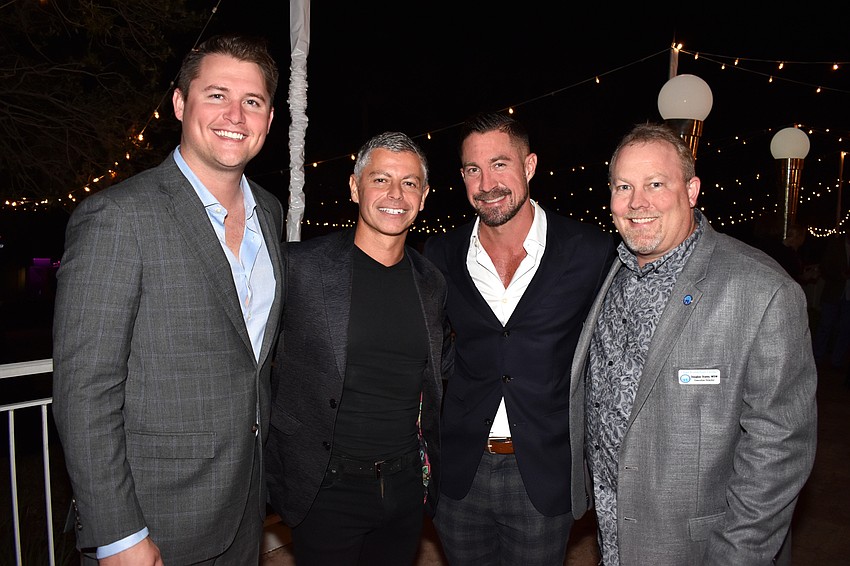 Chairmen Bart Lowther, Marko Radisic and Dan Starostecki with Child Protection Center Executive Director Doug Staley