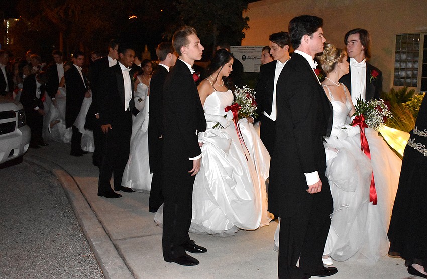 The Debutantes await their grand entrance with their escorts.
