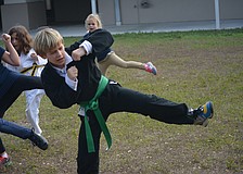 Jan. 12: Then-third grader Max Miville hits a side kick during a Clark&#39;s Self-Defense class at Philippi Shores Elementary, taught by Derrick Clark. The class also promotes non-violent ways to deal with bullying at school.