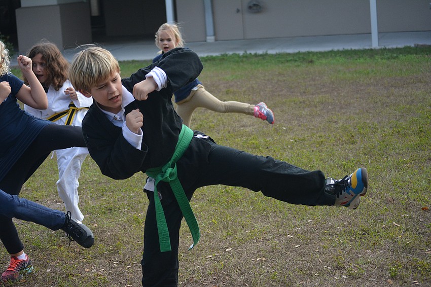 Jan. 12: Then-third grader Max Miville hits a side kick during a Clark's Self-Defense class at Philippi Shores Elementary, taught by Derrick Clark. The class also promotes non-violent ways to deal with bullying at school.