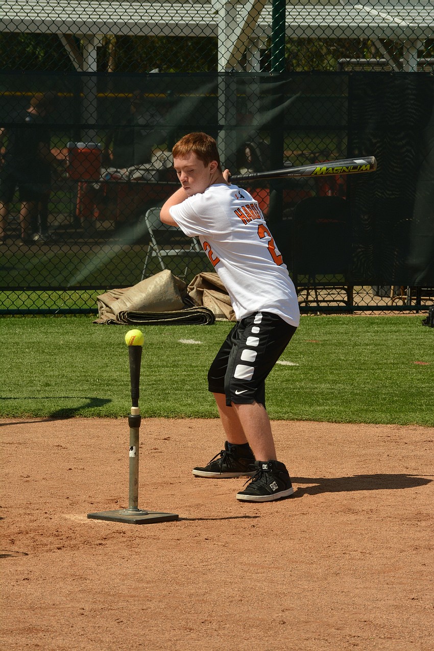 June 27: Oak Park School student Evan Justice takes a swing during a Baltimore Orioles clinic at Ed Smith Stadium. The clinic was solely for students of Oak Park, a school for people from pre-K to age 22 with special needs.