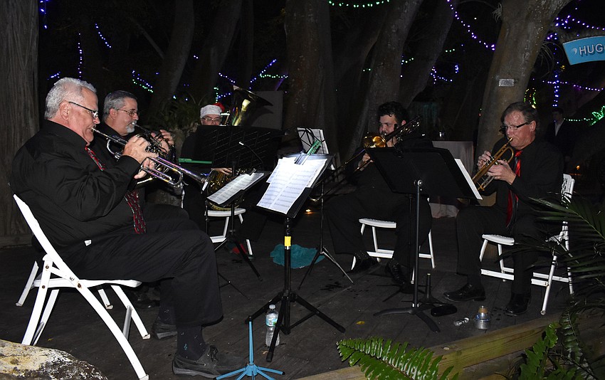 Members of the Brass Quartet of Sarasota Concert Band perform for guests.