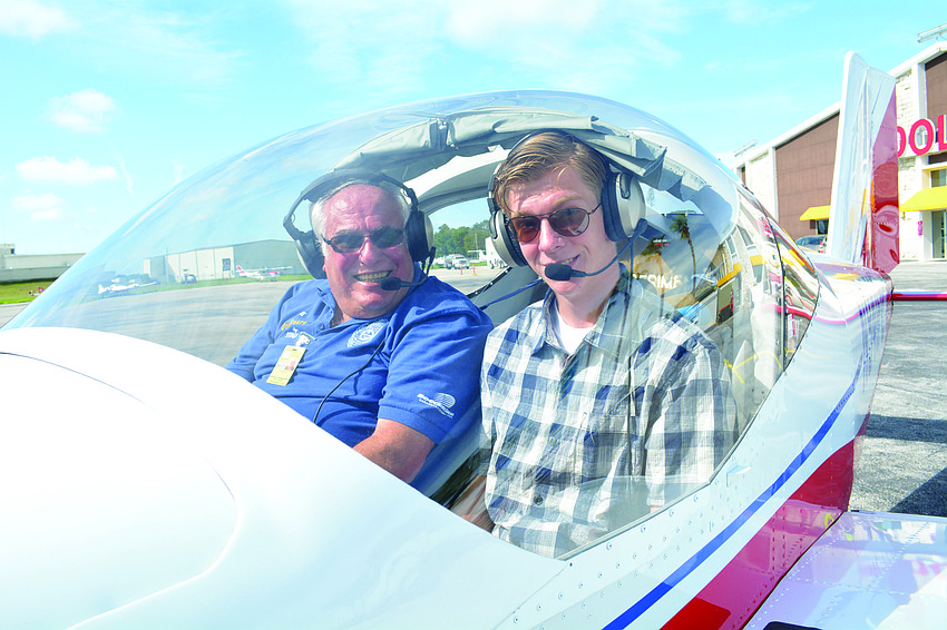 Ric Romanoff, a University Park pilot, takes off June 24 with Malcom Moniz in a two-seat Vans RV 12 plane.
