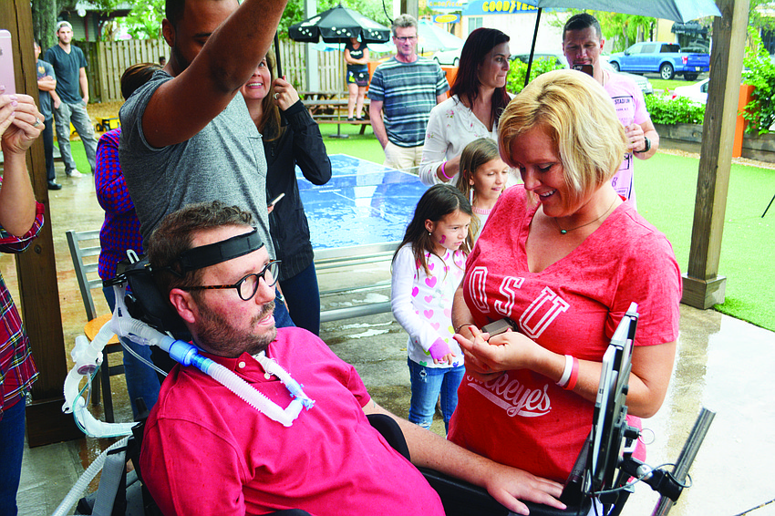 Fighting ALS didn't stop Lake Club's Kevin Swan from proposing to Shaina Fisch on Oct. 28 in a ceremony featuring the Southeast High School marching band.