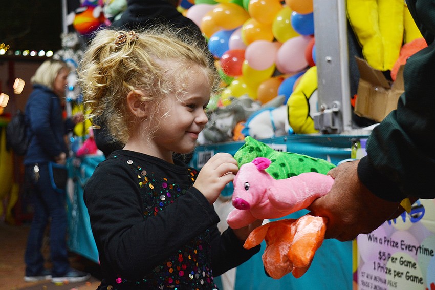 Emily Chana picks out her prize.