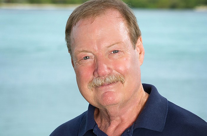 Reynolds become a senior scientist at Mote in 2001, and led the Manatee Research Program.