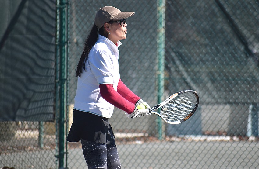 Ying Lee awaits the ball during a preliminary match.