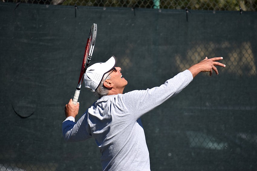 Ron Plashkes serves the ball during a preliminary match.