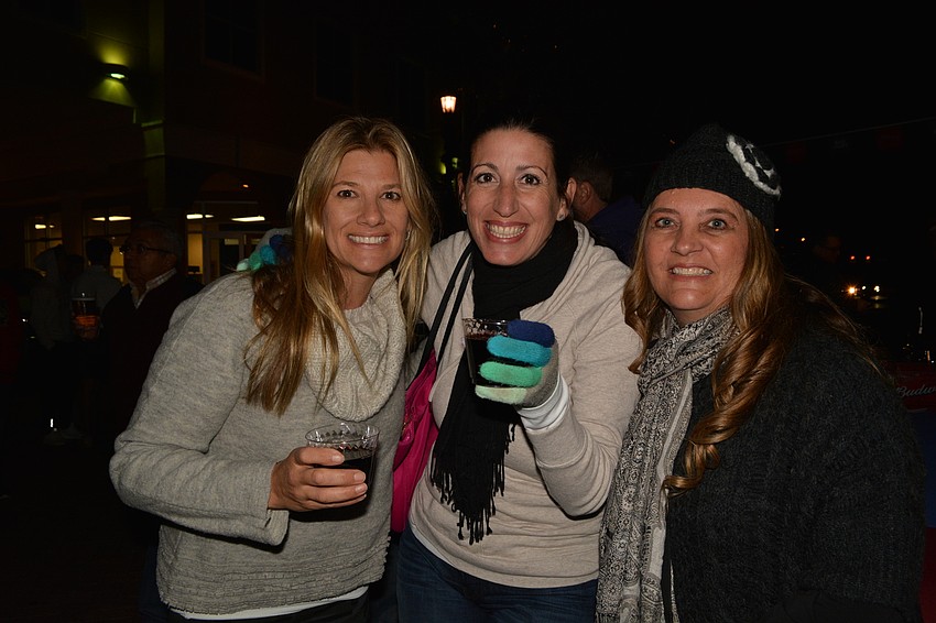 Heather Chase O'Neill, Phyllis Morales and Julie Katchen come to support the Cardinal Mooney lacrosse team, the night's benefiting charity.