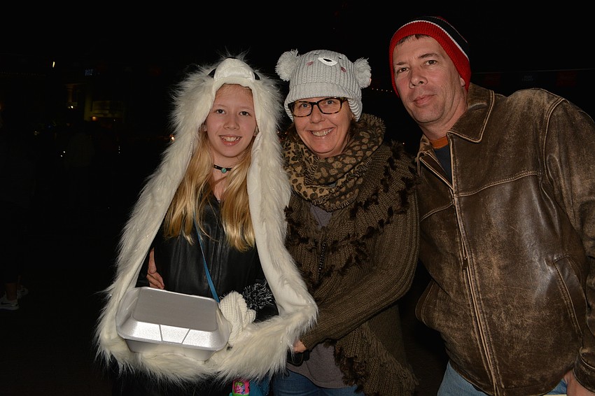 Chloe Talbott, pictured with her parents Jeanne and John Talbott, got her panda hat-glove combination while on a vacation in California.