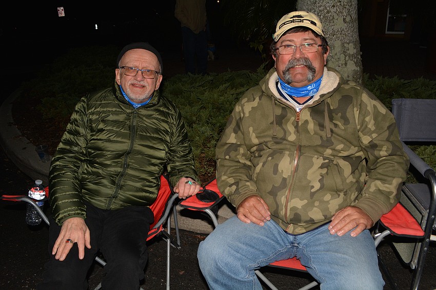 Part-time Sarasota residents Peirre Morier and Rod Carruthers get a front row seat for the concert. 