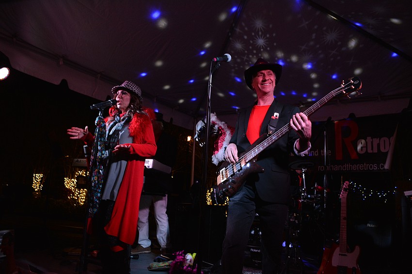 Robin and the Retros perform for event-goers.