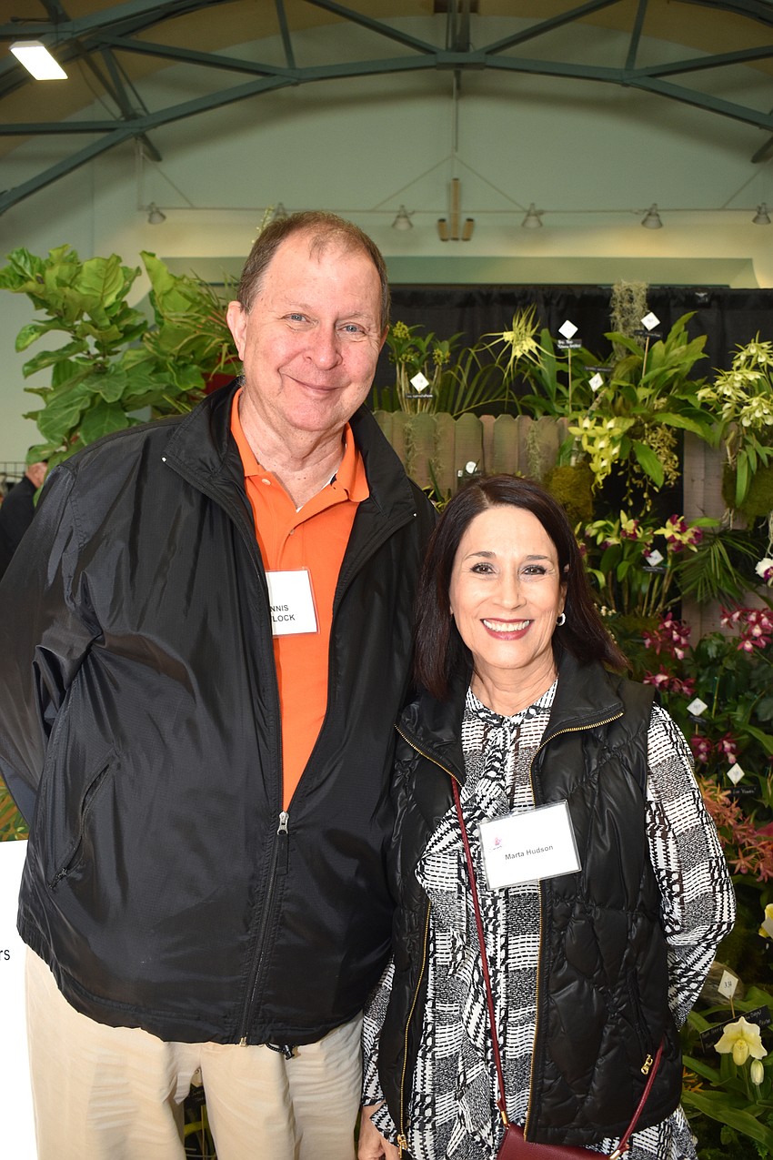 Outgoing Sarasota Orchid Society President Dennis Pavlock and incoming President Marta Hudson