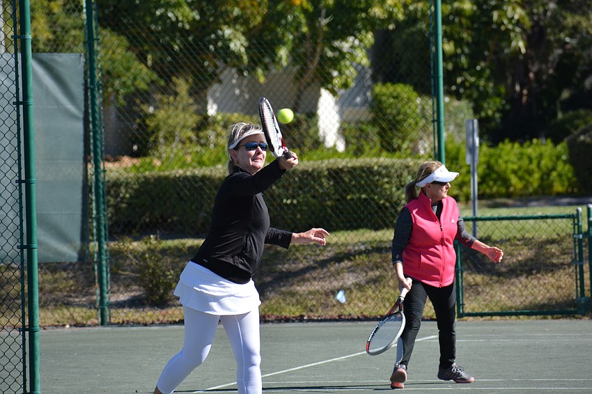 Irene Langlois volleys during the Division 3 women's singles match Sunday.