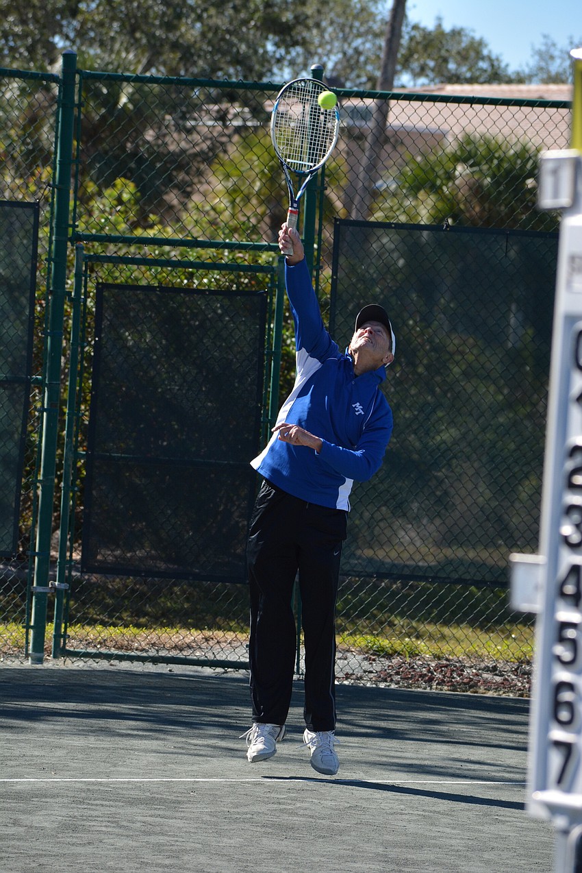 Andy Adams serves during a Division 1 match Sunday.