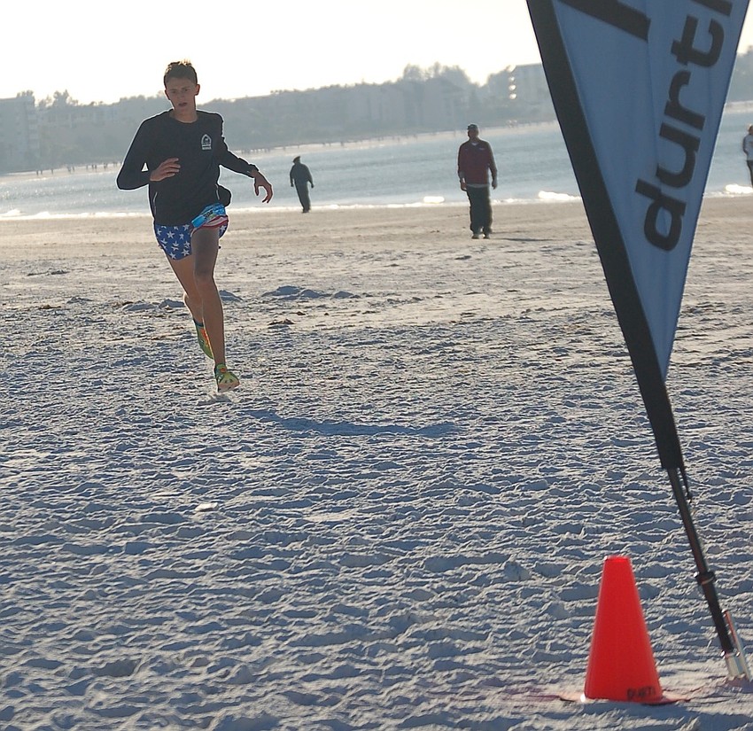 Connor Wozniak approaches the finish line as the overall winner.