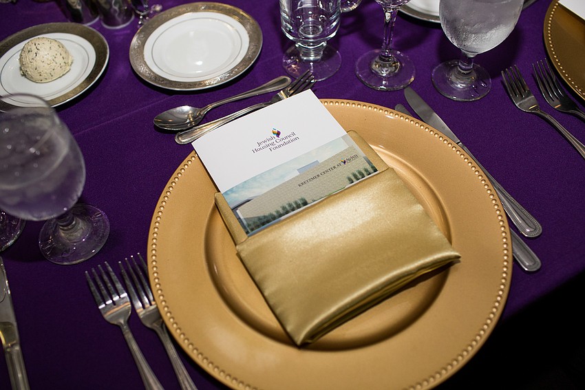 At each place setting, a pamphlet about the Kretzman Center dedication and dinner was placed in each guest's napkin.