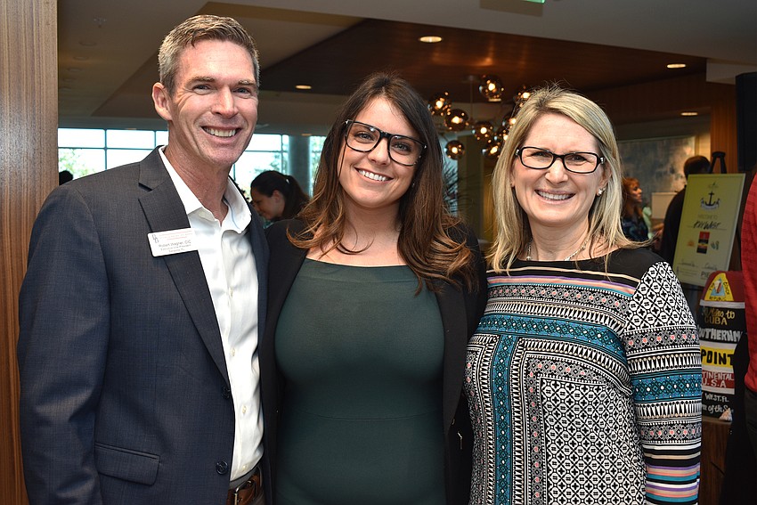 Robert Wagner, Breanca Niski and Tonya Atchison of event sponsor Brown & Brown Insurance
