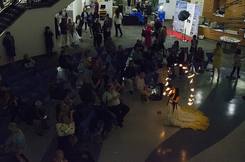 Attendees were enthralled by a dancer who incorporated fire into her performance.