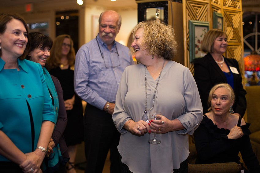 Debbie Trimble laughs with other audience members.