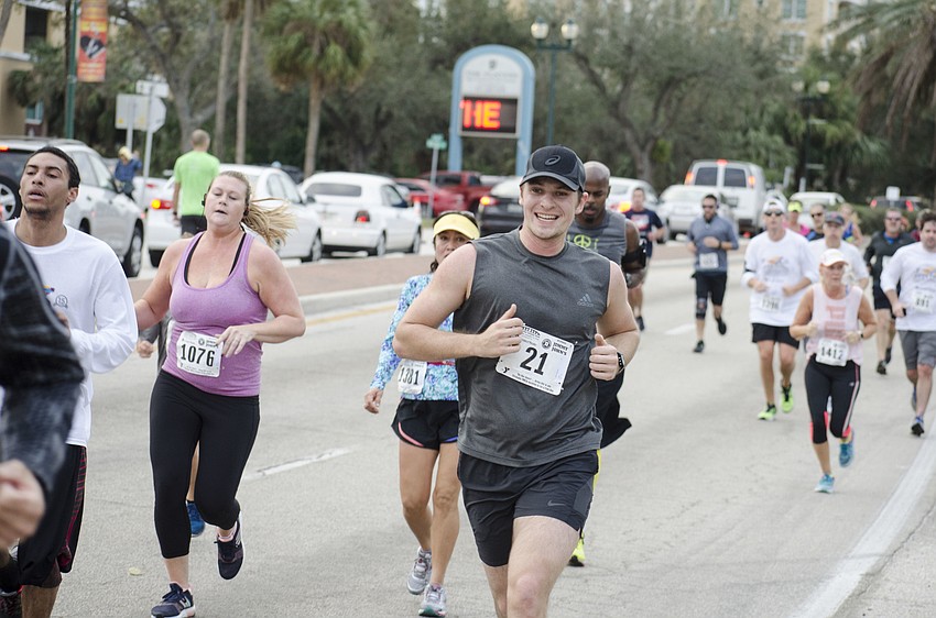 John Oravec grins as he nears the finish line.