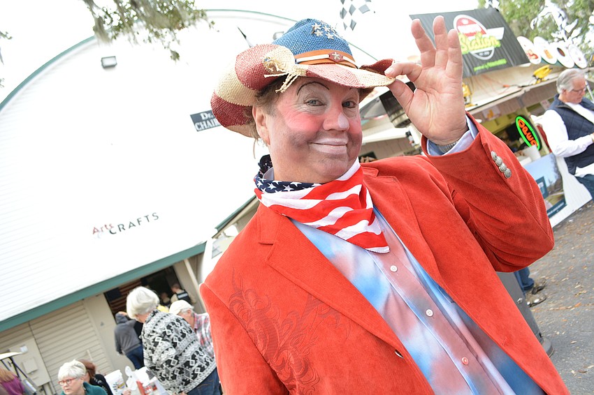 Dennis Lee, also known as Dennis the Rodeo Clown, helps promote a  corn dog eating contest. He also has a strolling act at the fair, as well.