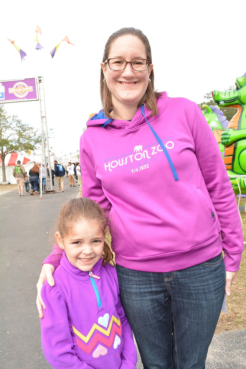 Lakewood Ranch Nora and Melissa England make their rounds to the midway rides.