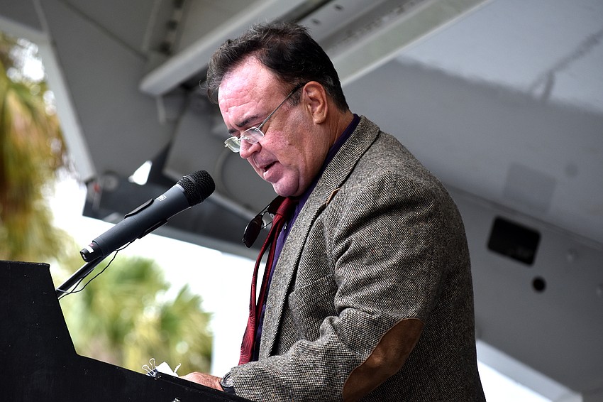 Ramon “Monchis” Espana speaks to the crowd about being part of The Flying Espanas.