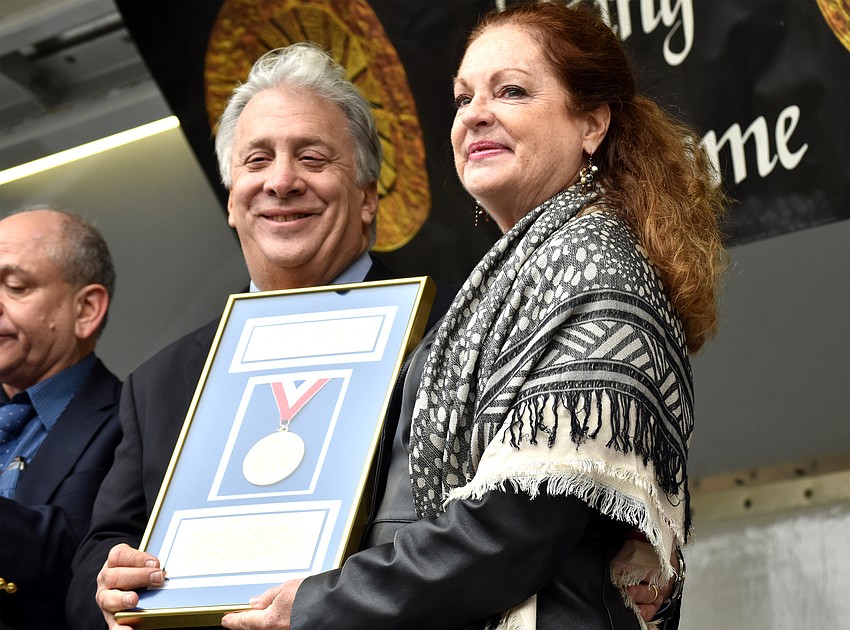 John Zamoiski and Sherry Powell show off Ursula Boettcher’s plaque.