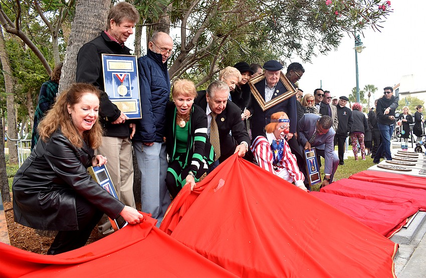 Inductees and their representatives reveal their plaques on the Circus Ring of Fame.