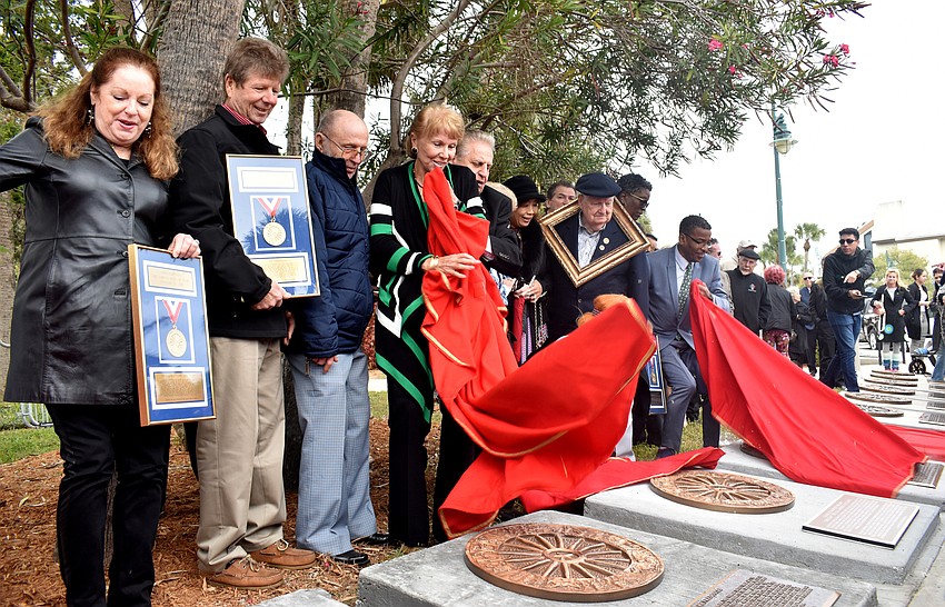 Inductees and their representatives reveal their plaques on the Circus Ring of Fame.