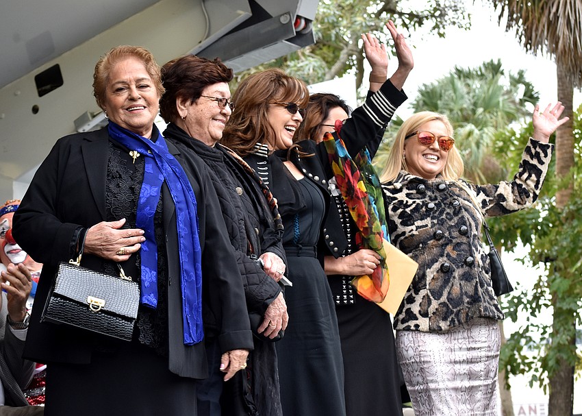 The Flying Espanas wave to the crowd following their induction.