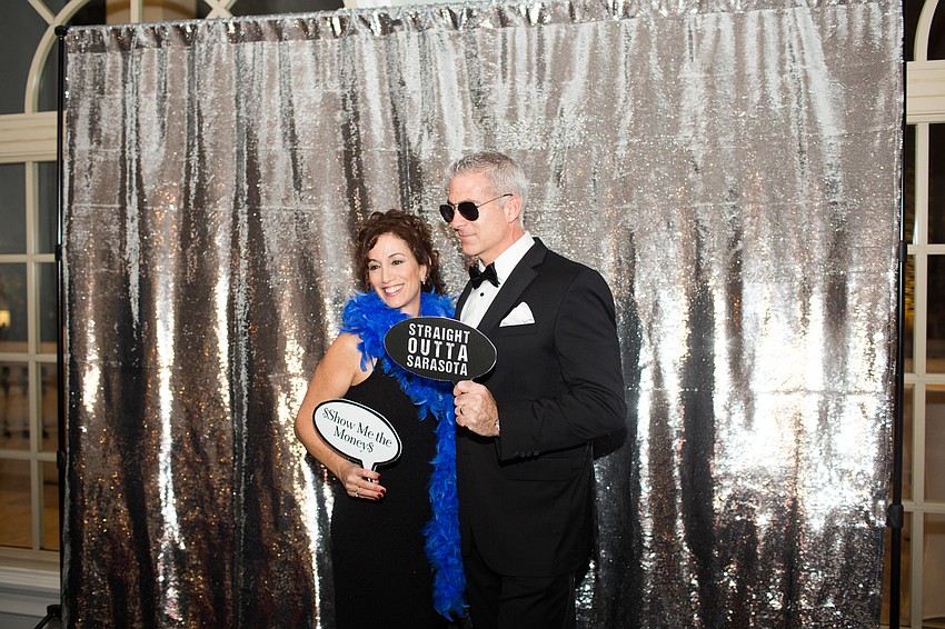 Maria DeCarlo and Aaron Diller pose for a photo at the photo booth.