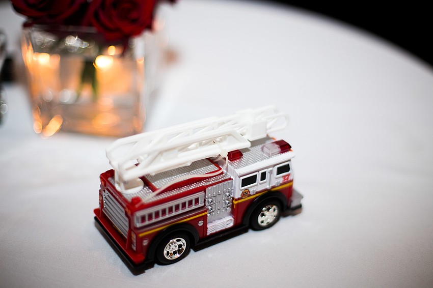 Toy fire trucks and other emergency vehicles adorned tables throughout the event.