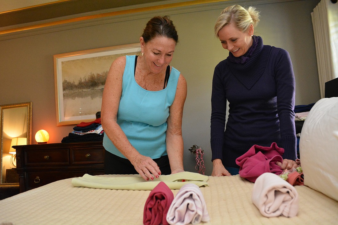 Palm Aire&#39;s Pattie Meades learns to fold her clothing using the KonMari Method with the help of professional organizer Elizabeth Player, of Tampa. The method is famous for its folding technique, which makes items "stand."