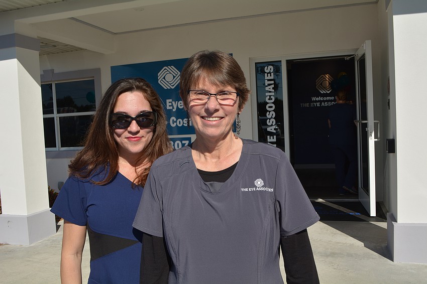 The Eye Associates technician Karrie Smiley and employee Nancy Ford welcome guests.
