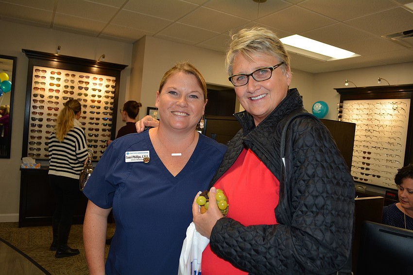 Clinic Director Caasi Phillips chats with longtime client Dian Pathak, of River Strand.