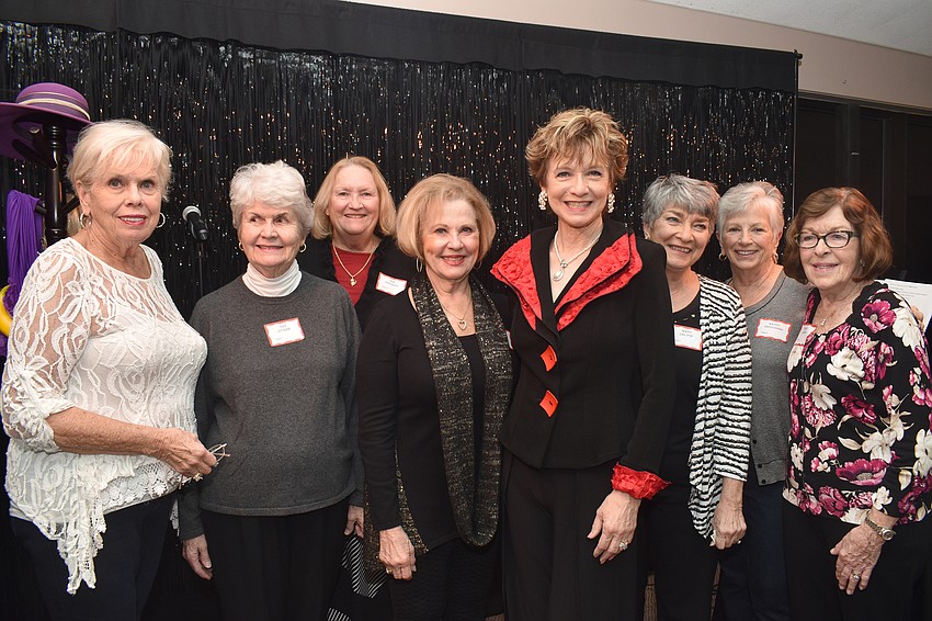 Party Planning committee members Marge Nuzzo, Pat Stusek, Susan Pariseau, performer Marcy Downey, Mary Delpup, Kathy Neudorfer and Peggy Jelinek