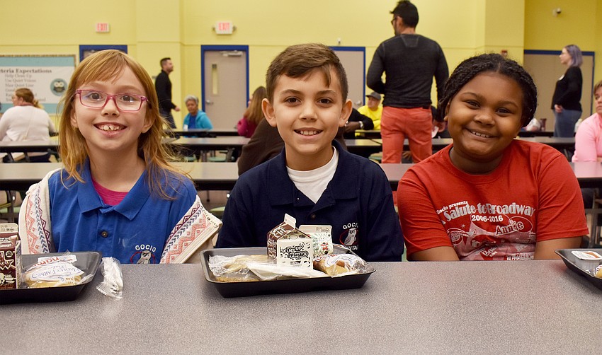 Dylan Rosenow, Jonathan Quintero and Arianna Gipson are all smiles at the pancake breakfast.
