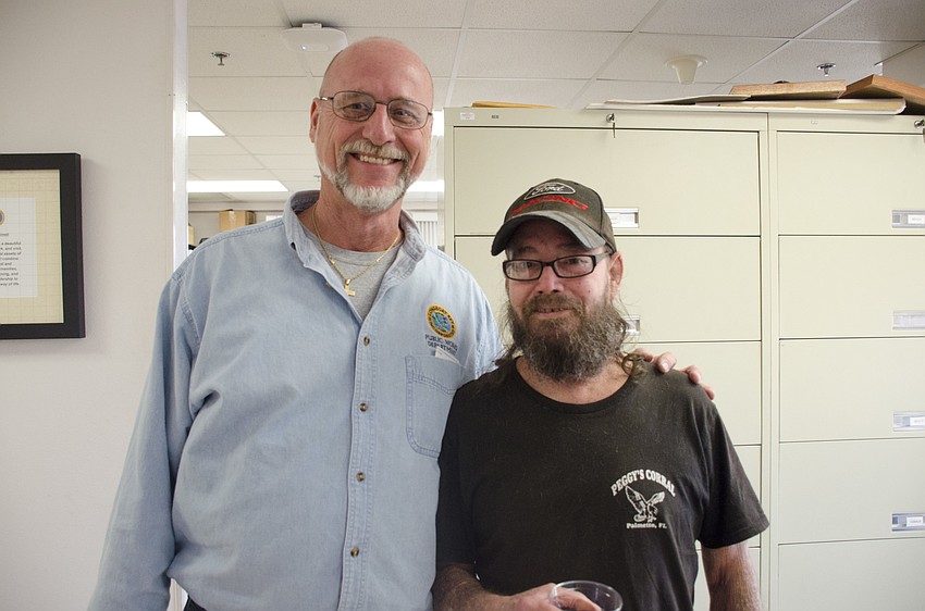 Project Manager James Linkogle (left) and former Public Works Operations Manager Neal Martin both gave speeches at Juan Florensa's going-away party.