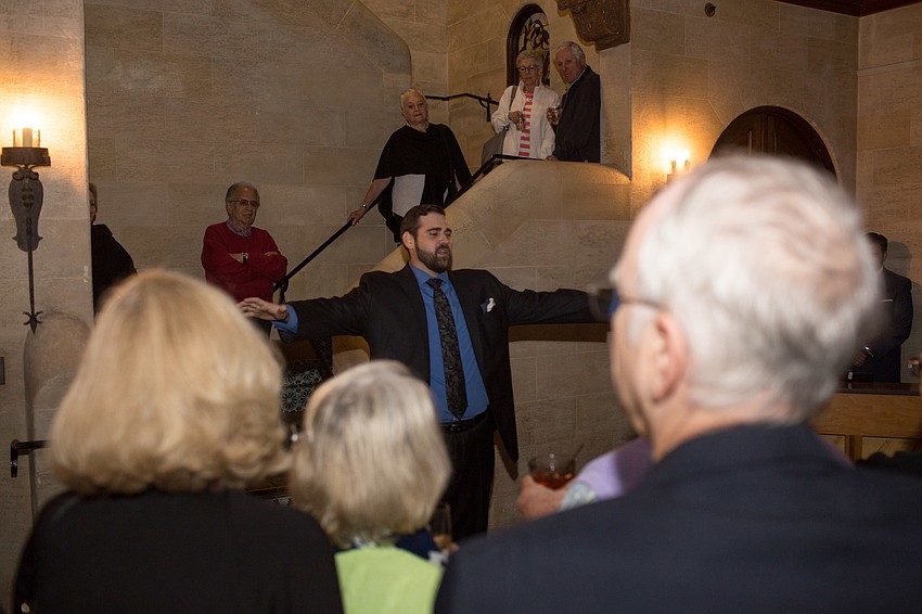 Jared Guest performs a song for the audience.
