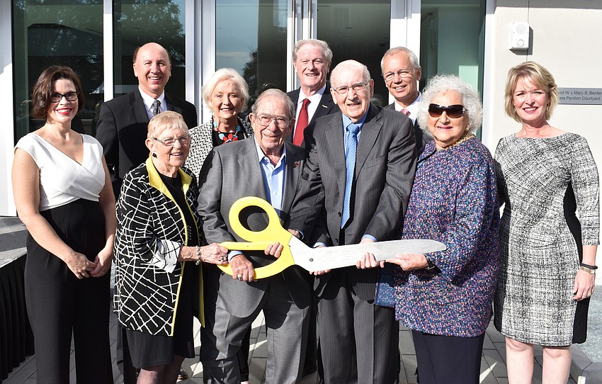 Donors, Gulf Coast Community Foundation employees and several team members from The Ringling and Florida State University pose with the ceremonial scissors.