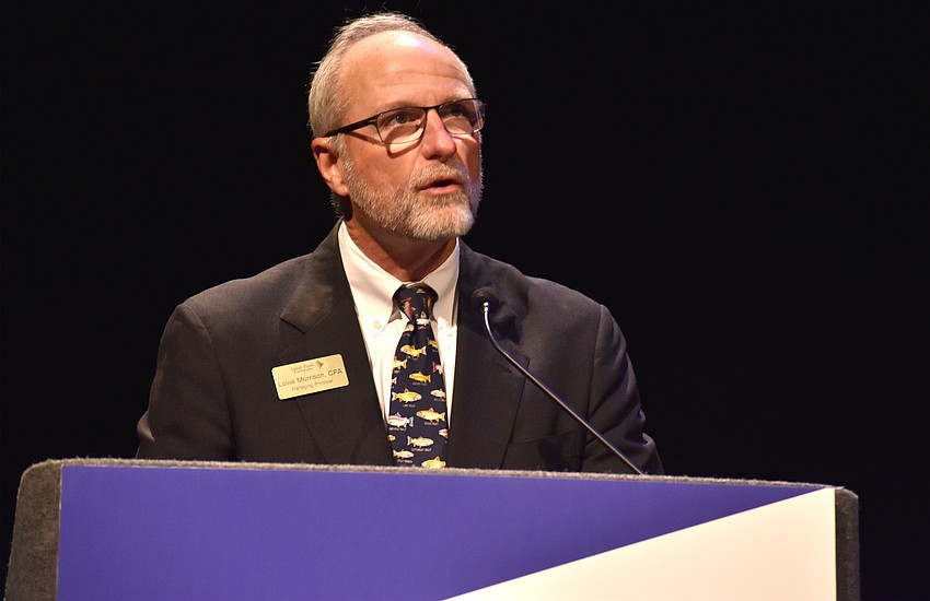 Lowe Morrison, of event sponsor Sabal Trust Company, welcomes the crowd to the lecture.