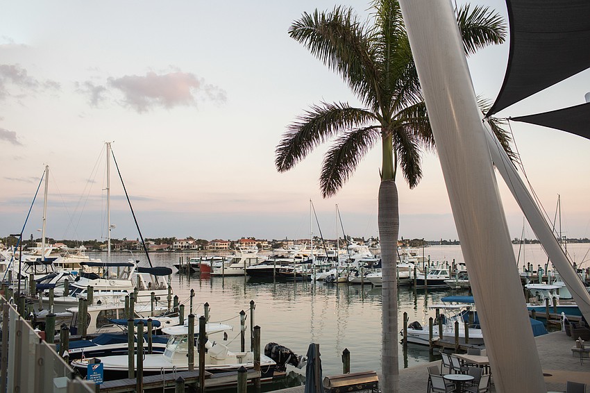 The balcony overlooking the yachts at the Sarasota Yacht Club provided the perfect space for guests to get fresh air and enjoy the view.