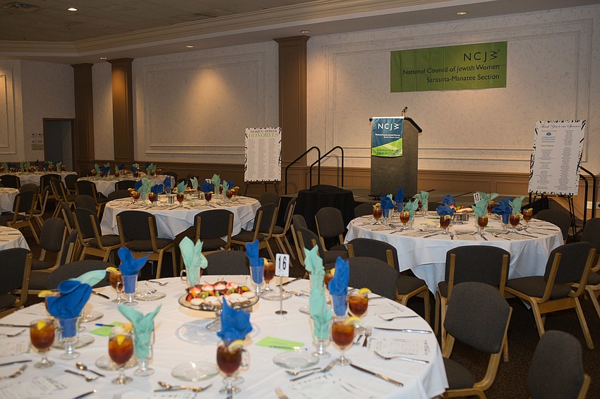 The room was colorfully done with blue and green napkins.