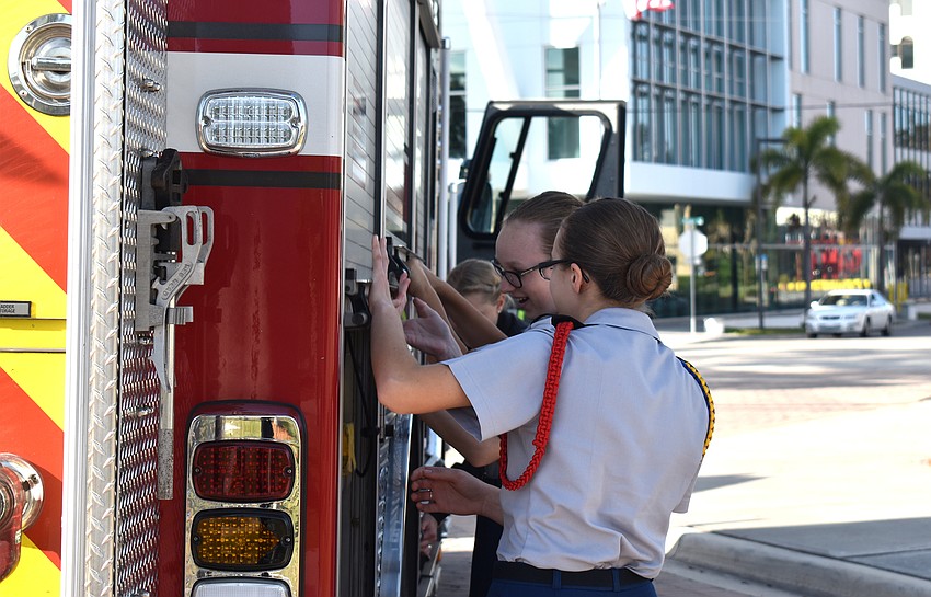 Sarasota Military Academy students check out a Sarasota fire truck.