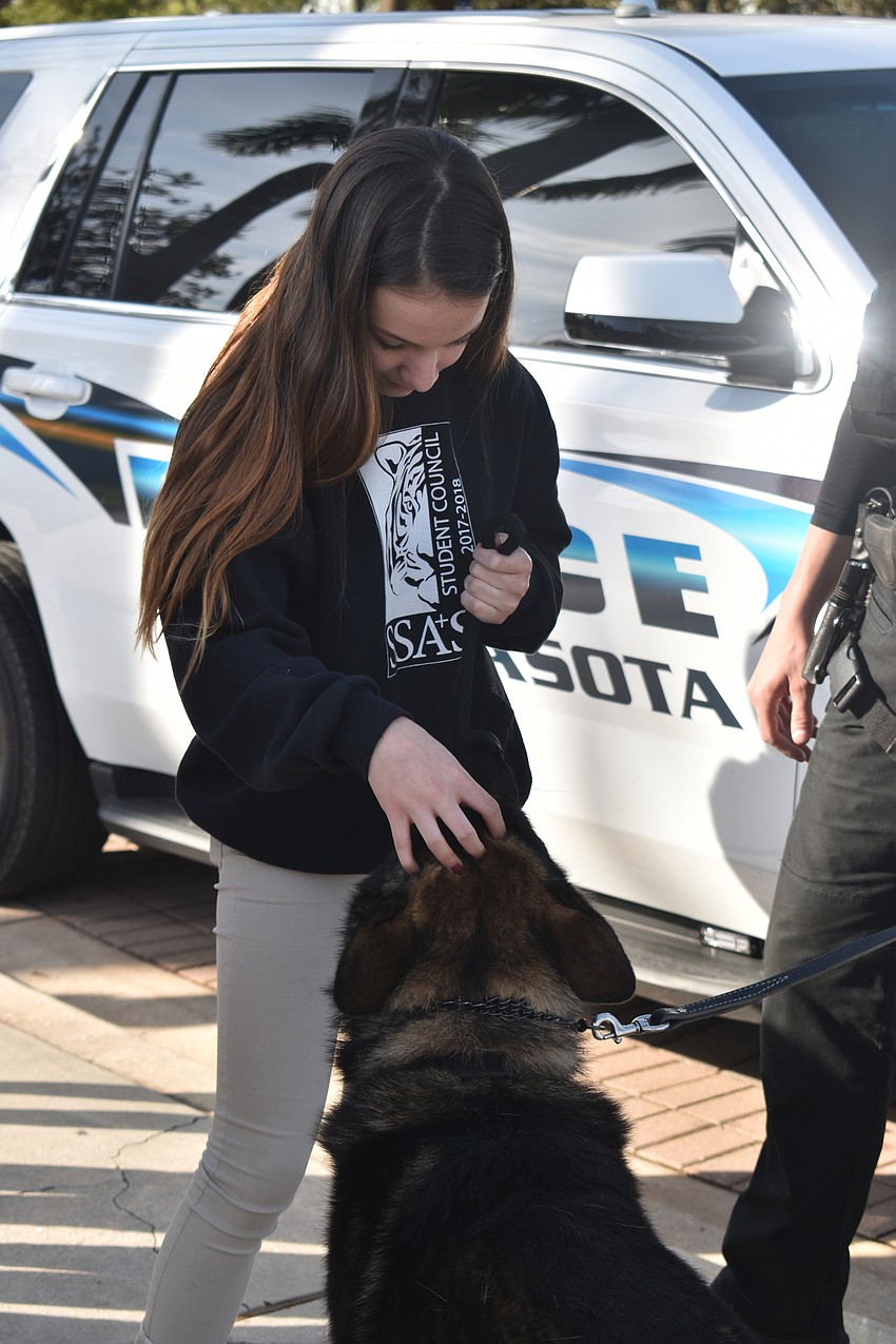 Amanda Orama of Sarasota School of Arts and Sciences gives Bronson a pet.