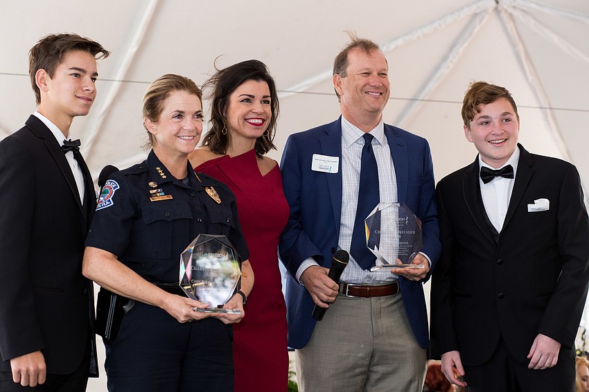 After receiving their awards,  Chief Bernadette DiPino and State Attorney Craig Schaeffer pose for a photo.