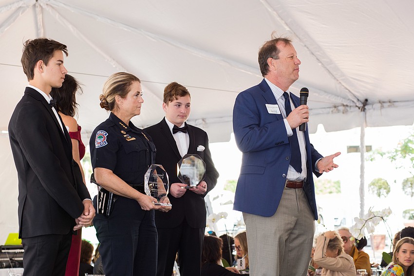State Attorney Craig Schaeffer gives a speech after receiving his champion defender award.